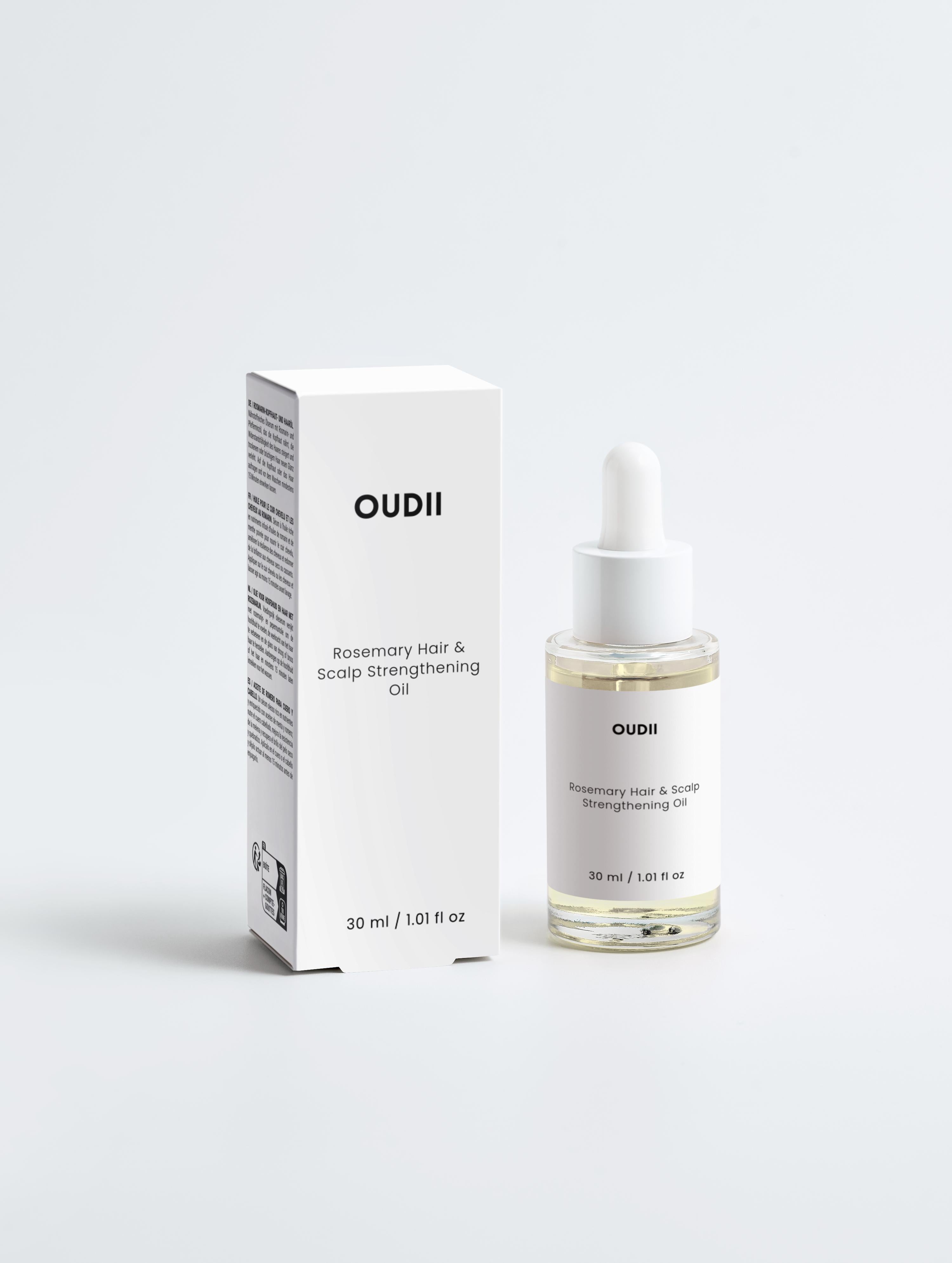 OUDII hair and scalp strengthening oil bottle and packaging on a white background